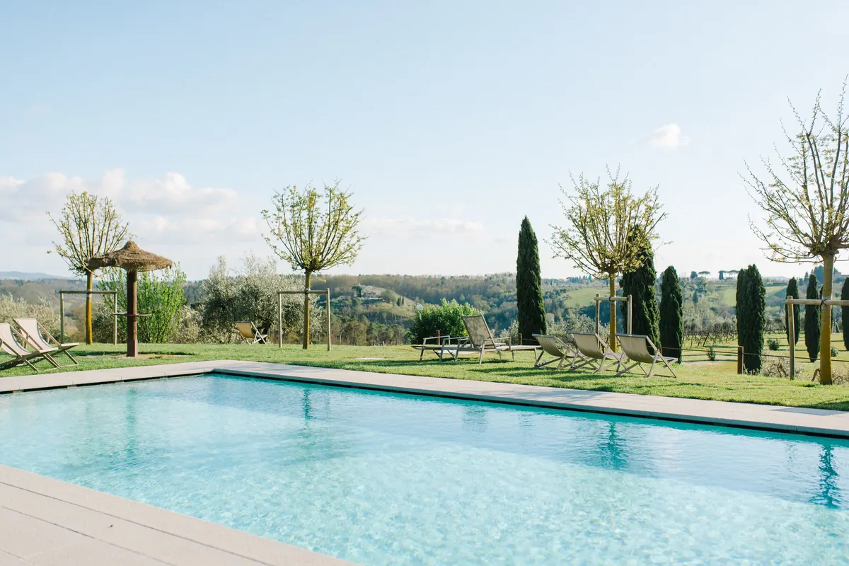 Pool and Tuscan hills at Salvadonica, a farmhouse estate in Chianti