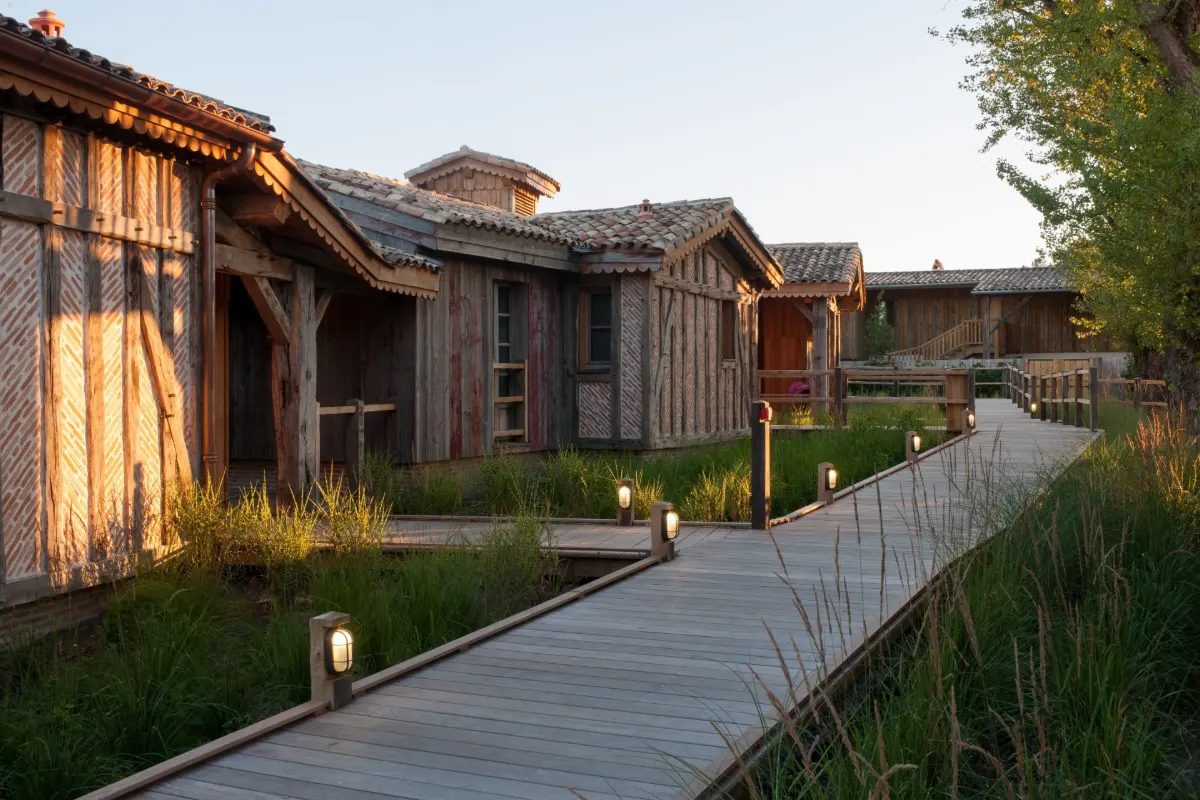 Wooden guest buildings and boardwalk at Les Sources de Caudalie, Martillac