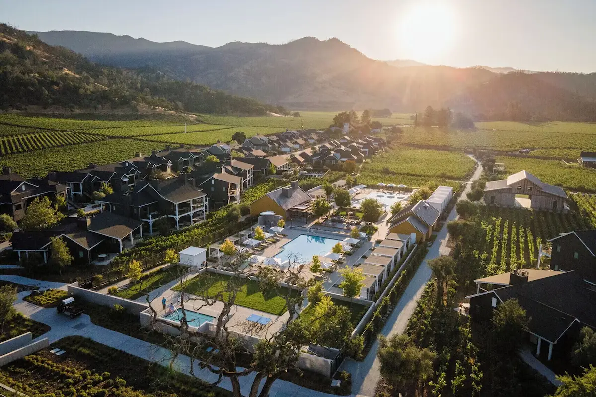 Vineyard rows, cottages and the pool at Four Seasons Resort and Residences Napa Valley in Calistoga