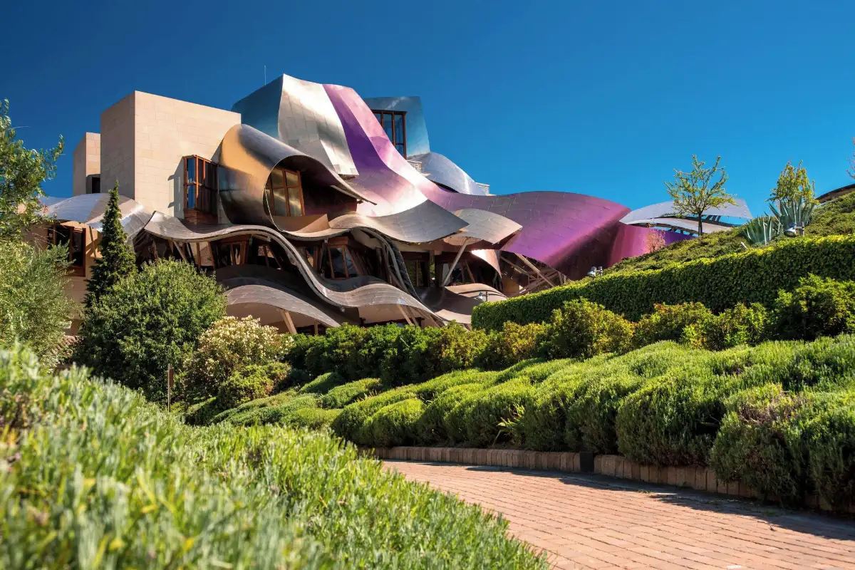 Pink and gold titanium roof by Frank Gehry above the gardens at Hotel Marques de Riscal in Elciego
