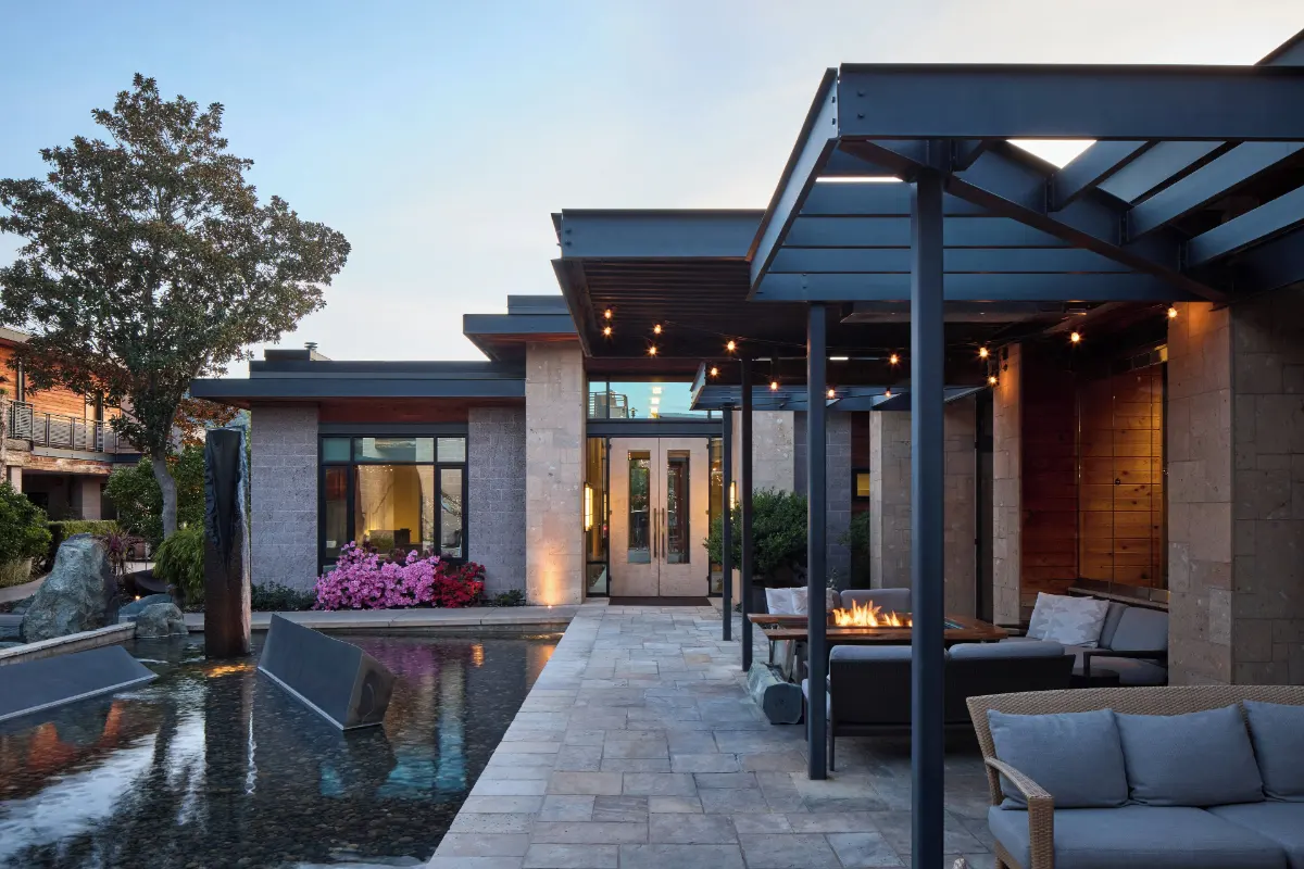 Stone, timber and steel entrance canopy with string lights at Bardessono Hotel and Spa in Yountville