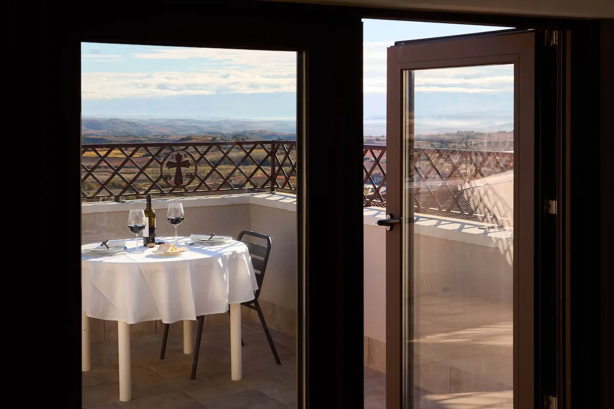 A terrace table set for two above the vineyards at El Retiro del Obispo in Laguardia