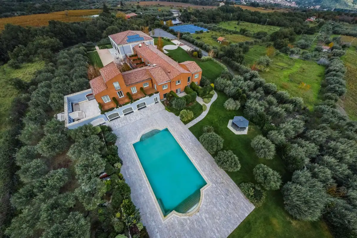 Aerial view of Villa Neri Resort & Spa in Linguaglossa: the villa, the pool and the olive trees around it