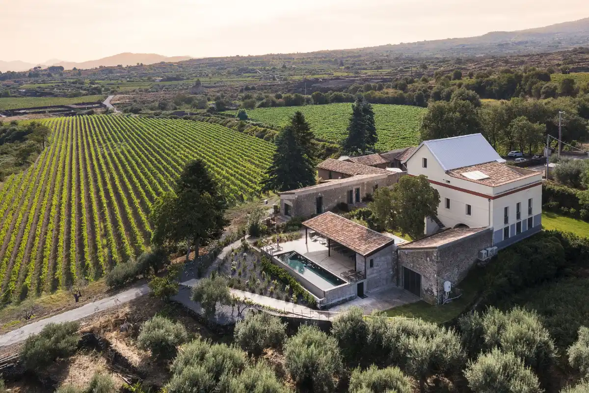 Aerial view of Dimora Cottanera, the stone villa among the vineyards of Contrada Iannazzo on the Etna north slope