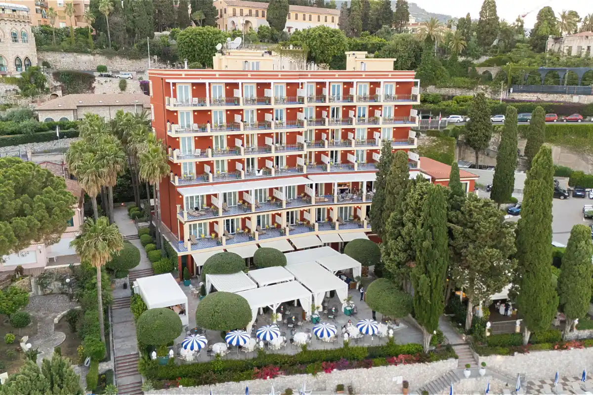 Grand Hotel San Pietro above its terraced gardens and cypresses, with the sea below Taormina