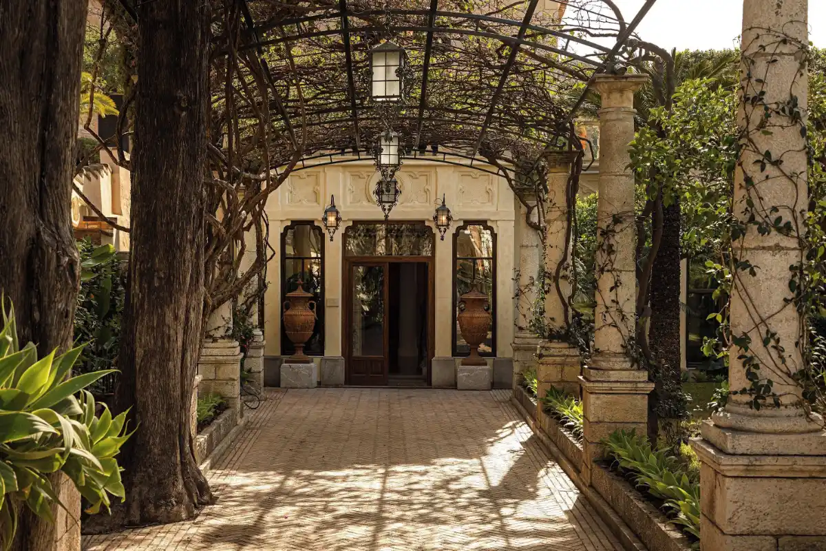 Wisteria pergola leading to the entrance of Grand Hotel Timeo in Taormina