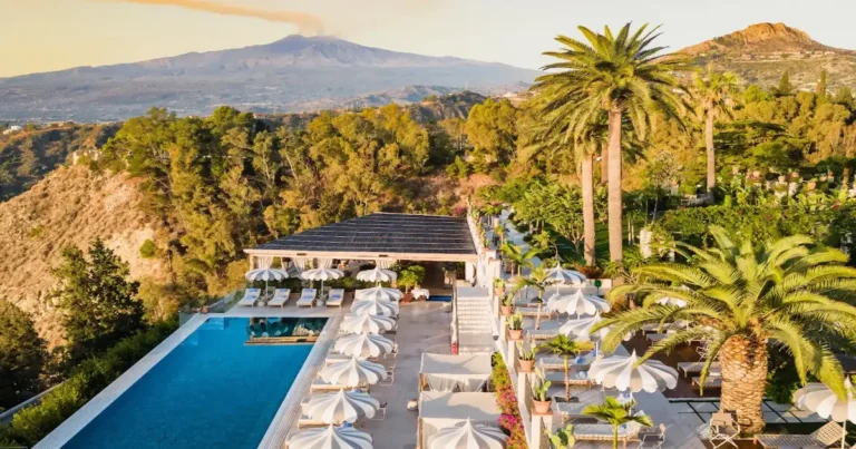 San Domenico Palace pool terrace in Taormina, with Mount Etna across the bay