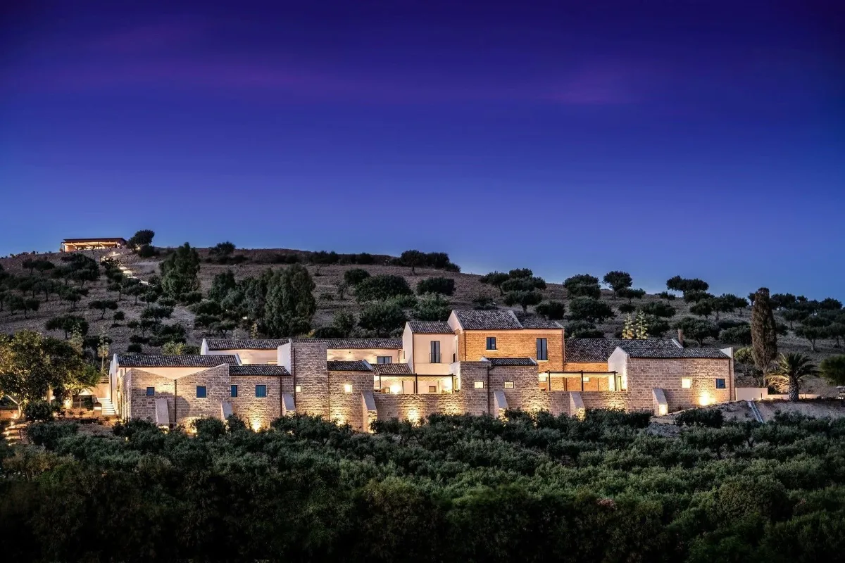 Baglio Sorìa Resort lit at dusk on the hillside outside Trapani