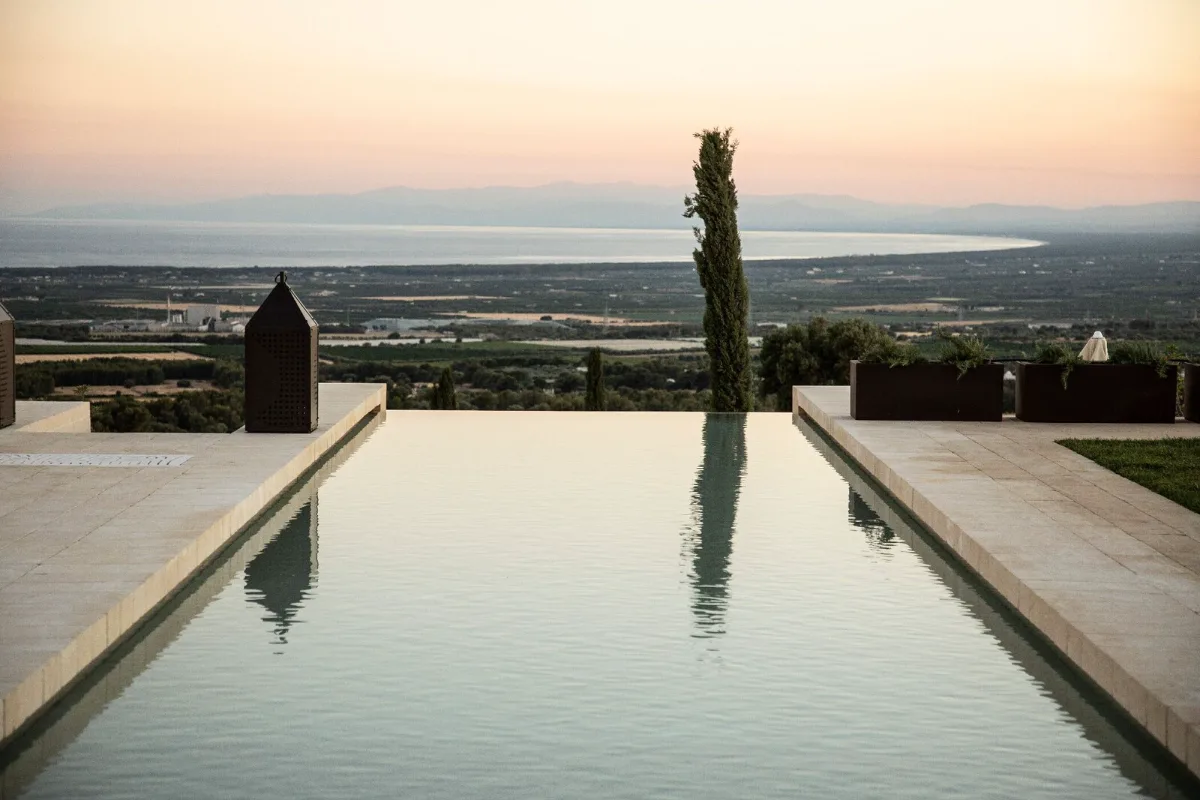 Long pool at Masseria Amastuola looking over the countryside to the Gulf of Taranto at sunset