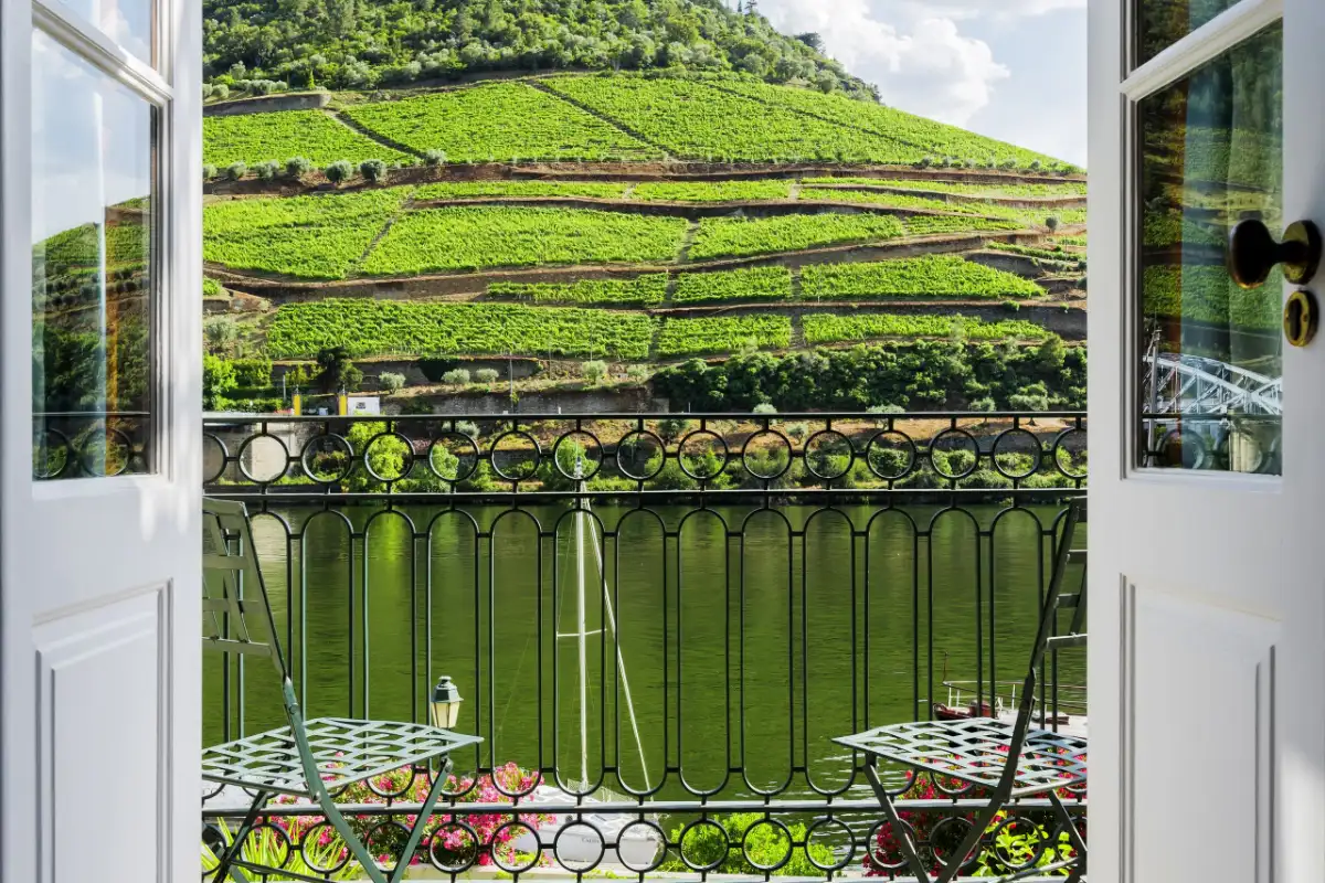 Open French doors onto a balcony above the Douro at The Vintage House in Pinhão
